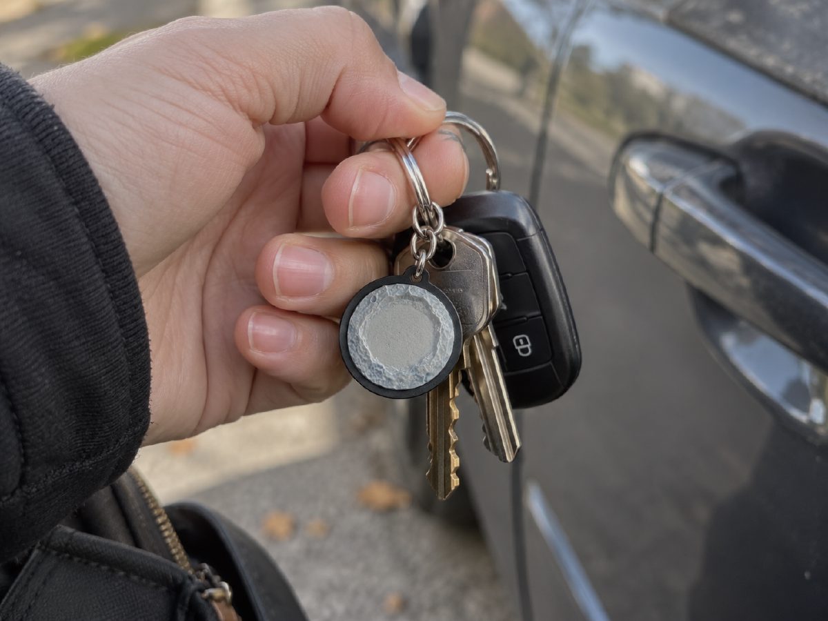 Small round crater keychain on a set of car keys
